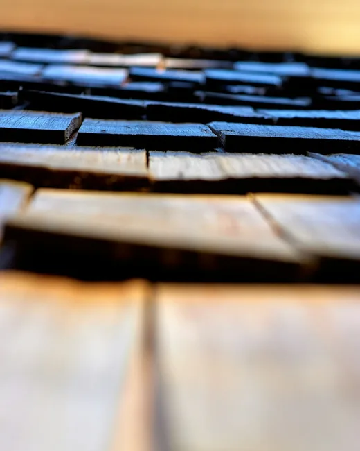 Piano keys in warm golden light — instrument craft